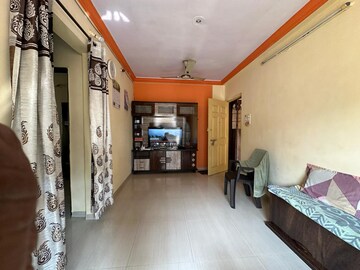 Living Room in 2 BHK Apartment at Shankheshwar Nagar CHS, Dombivli East – for Sale