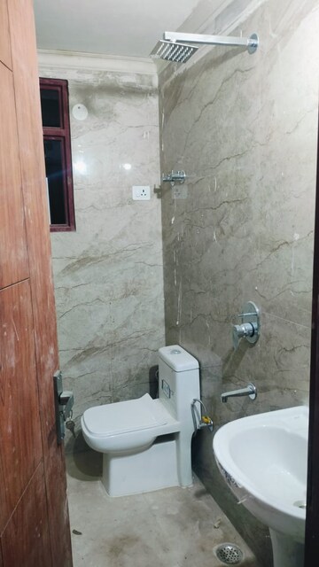 Bathroom in 1.5 BHK Builder Floor at Chattarpur – for Sale