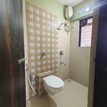 Bathroom in 1 BHK Apartment at Raunak Unnathi Woods Phase 7 A And B, Kasarvadavali – for Sale