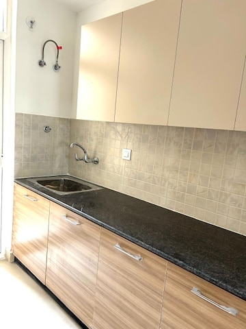 Kitchen in 3 BHK Apartment at Amrapali Golf Homes, Sector 4, Greater Noida – for Sale