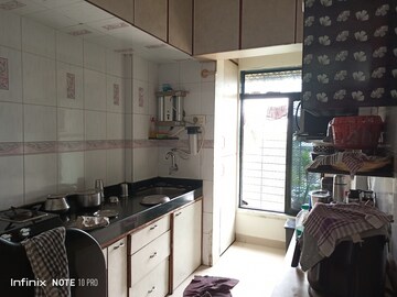 Kitchen in 2 BHK Apartment at Swagat CHS Kopar Khairane, Kopar Khairane – for Sale