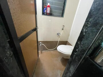 Bathroom in 1 RK Apartment at Om Krishna CHS, Dahisar East – for Sale