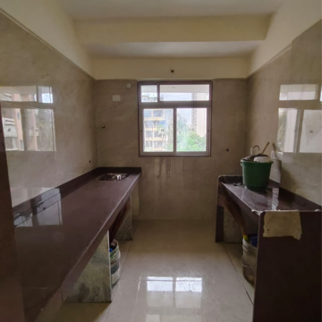 Kitchen in 2 BHK Apartment at Divine Blue Star CHS, Ic Colony – for Sale