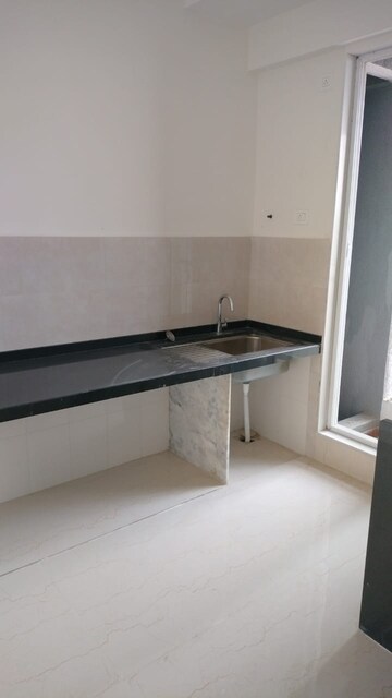 Kitchen in 3 BHK Apartment at Hiranandani Estate Spring Hill, Ghodbunder Road – for Sale