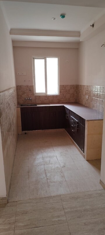 Kitchen in 2.5 BHK Apartment at Amrapali Golf Homes, Sector 4, Greater Noida – for Sale