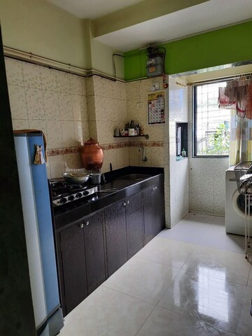 Kitchen in 1 BHK Apartment at Girishikhar Apartment, Borivali East – for Sale