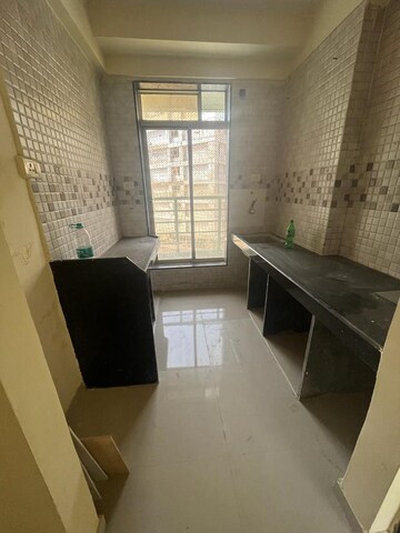 Kitchen in 1 BHK Apartment at Bhamini Sankul, Naigaon East – for Sale
