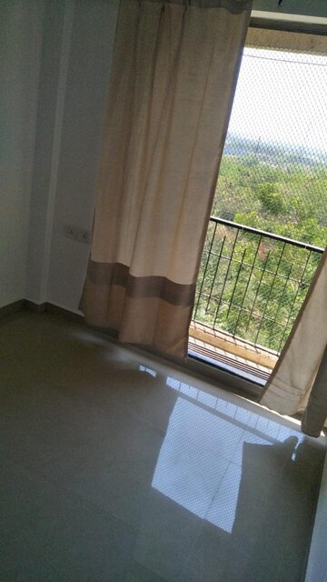 Living Room in 1 BHK Apartment at Unicorn Global Arena, Naigaon East – for Sale