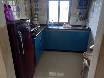 Kitchen in 1 BHK Apartment at Raunak Heights, Ghodbunder Road – for Sale