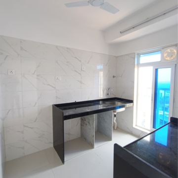 Kitchen in 2.5 BHK Apartment at Romell Serene, Ic Colony – for Sale