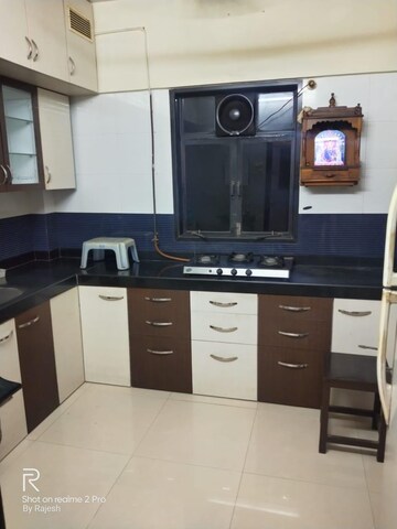Kitchen in 3 BHK Builder Floor at Omkar Alta Monte, Malad East – for Sale