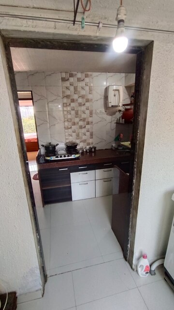 Kitchen in 2 BHK Apartment at Sri Badrinath CHS, Dahisar East – for Sale