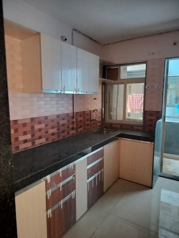 Kitchen in 2 BHK Apartment at Jangid Galaxy, Ghodbunder Road – for Sale
