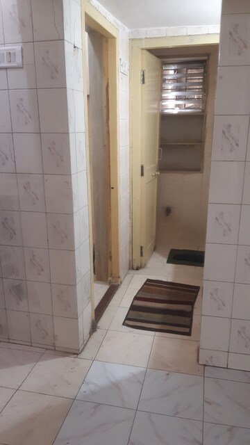 Kitchen in 3 BHK Apartment at Anandvan CHS Nerul, Nerul Sector 4 – for Sale