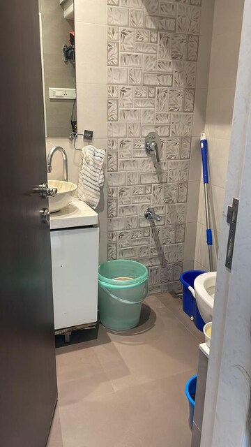 Bathroom in 3 BHK Apartment at Bredco New Viceroy Park , Kandivali East – for Sale