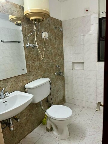 Bathroom in 4 BHK Apartment at Emaar MGF The Palm Drive Studios, Sector 66 – for Sale