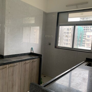 Kitchen in 2 BHK Apartment at Adinath CHS, Kastur Park – for Sale