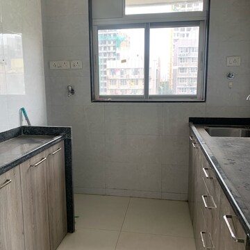 Kitchen in 2 BHK Apartment at Adinath CHS, Kastur Park – for Sale