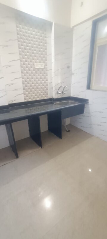 Kitchen in 2 BHK Apartment at Mohan Willows, Badlapur East – for Sale