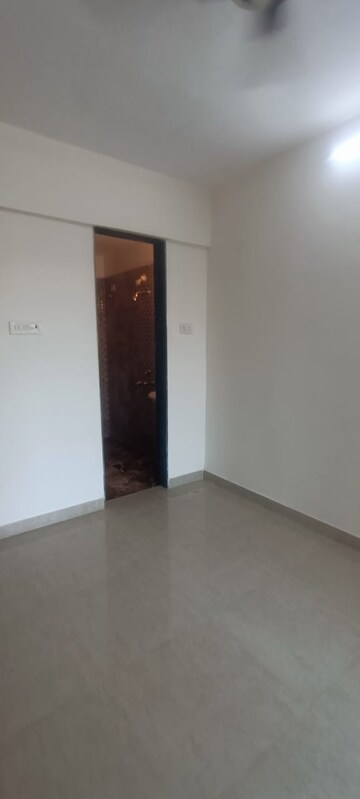 Room in 2 BHK Apartment at Mohan Willows, Badlapur East – for Sale