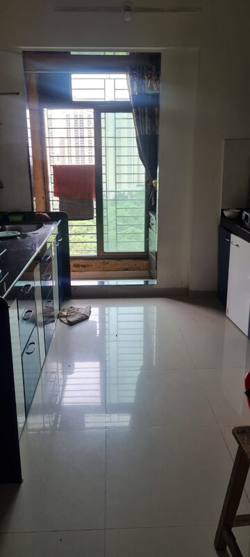 Kitchen in 2 BHK Apartment at Shree Satya Shankar Residency, Manpada – for Sale