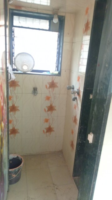 Bathroom in 1 BHK Apartment at Guru Samarth Krupa CHS, Dombivli West – for Sale
