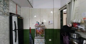 Kitchen in 1 BHK Apartment at Gangotri Glacier CHS, Waghbil – for Sale