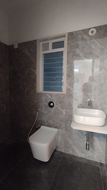 Bathroom in 2 BHK Apartment at Triveni Pearl, Khadakpada – for Sale