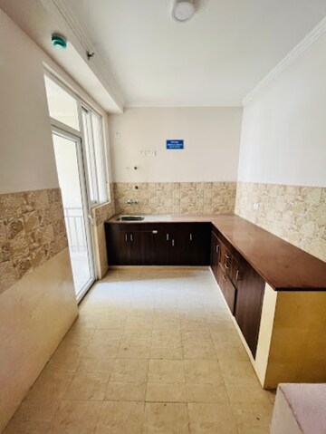 Kitchen in 2 BHK Apartment at Amrapali Golf Homes, Sector 4, Greater Noida – for Sale