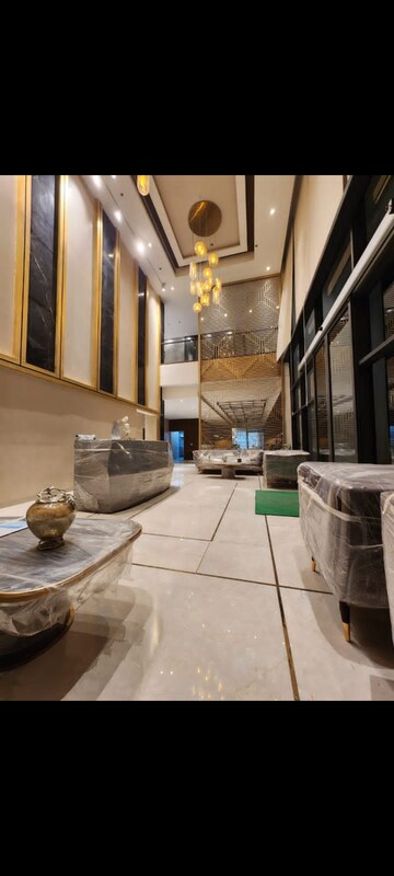 Living Room in 5 BHK Apartment at Maya Green Lotus Utsav, International Airport Road – for Sale