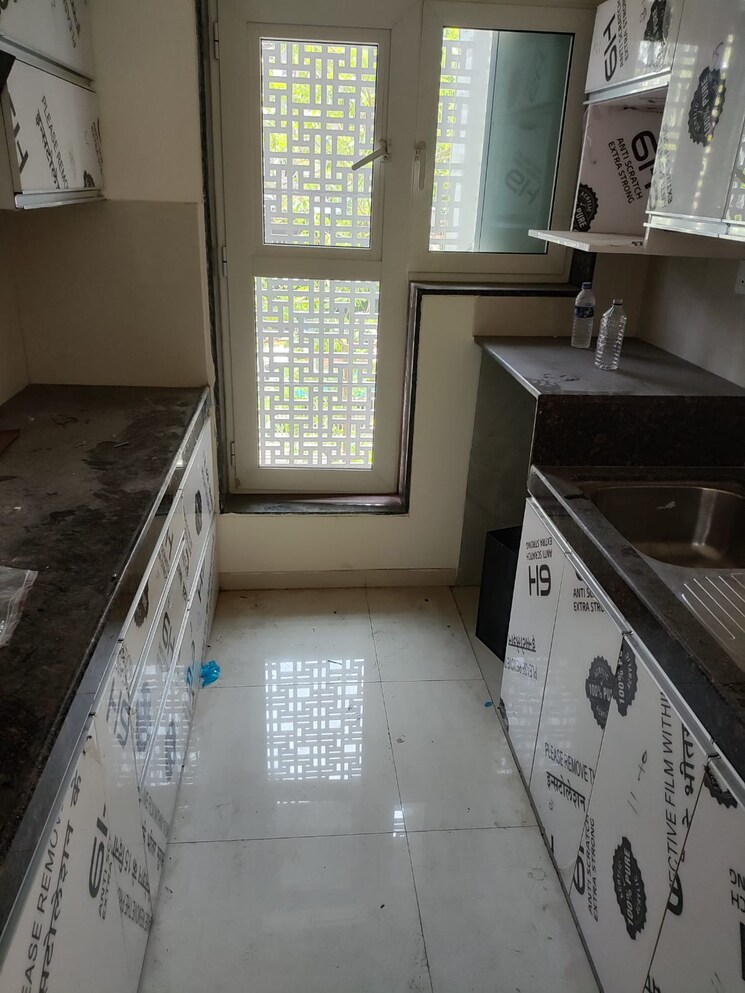 Kitchen, l-t-seawoods-residences-phase-1-part-a 2 Bedroom 825 Sq.Ft. Apartment In Seawoods Navi Mumbai 7524979