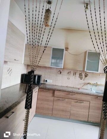 Kitchen in 2.5 BHK Apartment at ABA Orange County, Ahinsa Khand 1 – for Sale