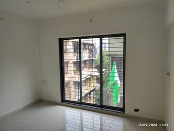 Bedroom in 2 BHK Apartment at Navkar Sakshat Navkar, Borivali West – for Sale