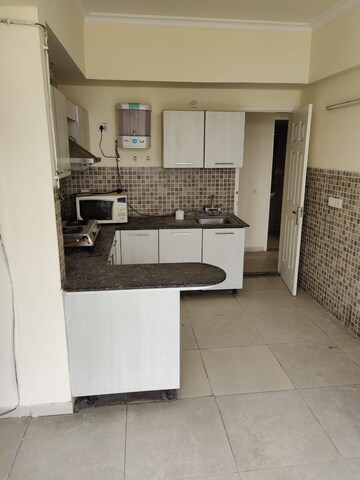 Kitchen in 4 BHK Apartment at Tata Primanti-Executive Apartments, Sector 72 – for Sale