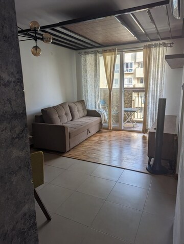 Living Room in 1 BHK Apartment at Bhartiya Nikoo Homes, Thanisandra Main Road – for Sale
