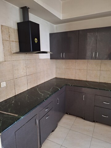 Kitchen in 3 BHK Apartment at Puri Pranayam, Sector 82 – for Sale