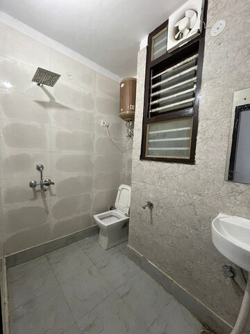 Bathroom in 1.5 BHK Builder Floor at Chattarpur – for Sale