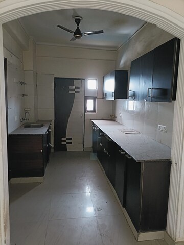 Kitchen in 2 BHK Apartment at Sangwan Heights, Raj Nagar Extension – for Sale