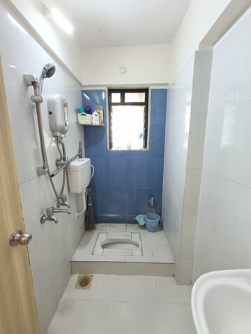 Bathroom in 2 BHK Apartment at Unnati Woods CHS, Kasarvadavali – for Sale