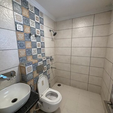 Bathroom in 2 BHK Apartment at Paradigm Business Hermitage Park, Dhakoli Village – for Sale