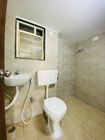 Bathroom in 1 BHK Apartment at Landmark Ekdant Pooja CHS, Kulgaon – for Sale