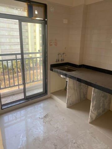 Kitchen in 1 BHK Apartment at Unique Nirmal Nagari, Khardipada – for Sale