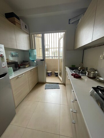 Kitchen in 3 BHK Apartment at Bhartiya Nikoo Homes Phase 2, Thanisandra Main Road – for Sale
