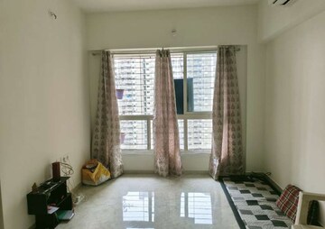 Living Room in 2 BHK Apartment at Lodha Amara, Kolshet Road – for Sale
