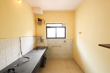 Kitchen in 1 BHK Apartment at Brahmand CHS, Brahmand – for Sale