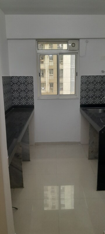 Kitchen in 1 BHK Apartment at Lodha Amara, Kolshet Road – for Sale