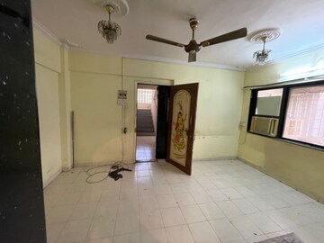 Living Room in 1 BHK Apartment at Shree Suryodaya CHS, Dahisar East – for Sale