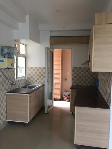Kitchen in 3 BHK Apartment at Amrapali Golf Homes, Sector 4, Greater Noida – for Sale