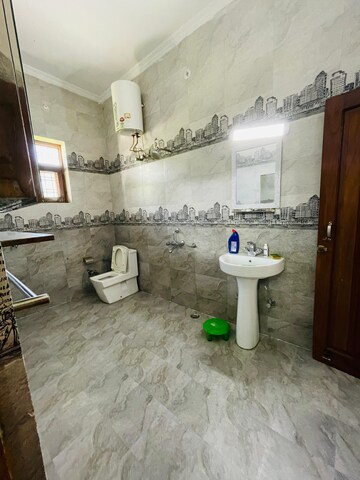 Bathroom in 3 BHK Builder Floor at Sahastradhara Road – for Sale