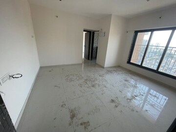 Living Room in 1 BHK Apartment at Harshal Devchhaya, Dahisar East – for Sale